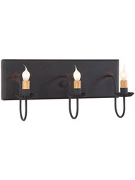 Three Arm Vanity Light Sconce in Black Over Red Color.